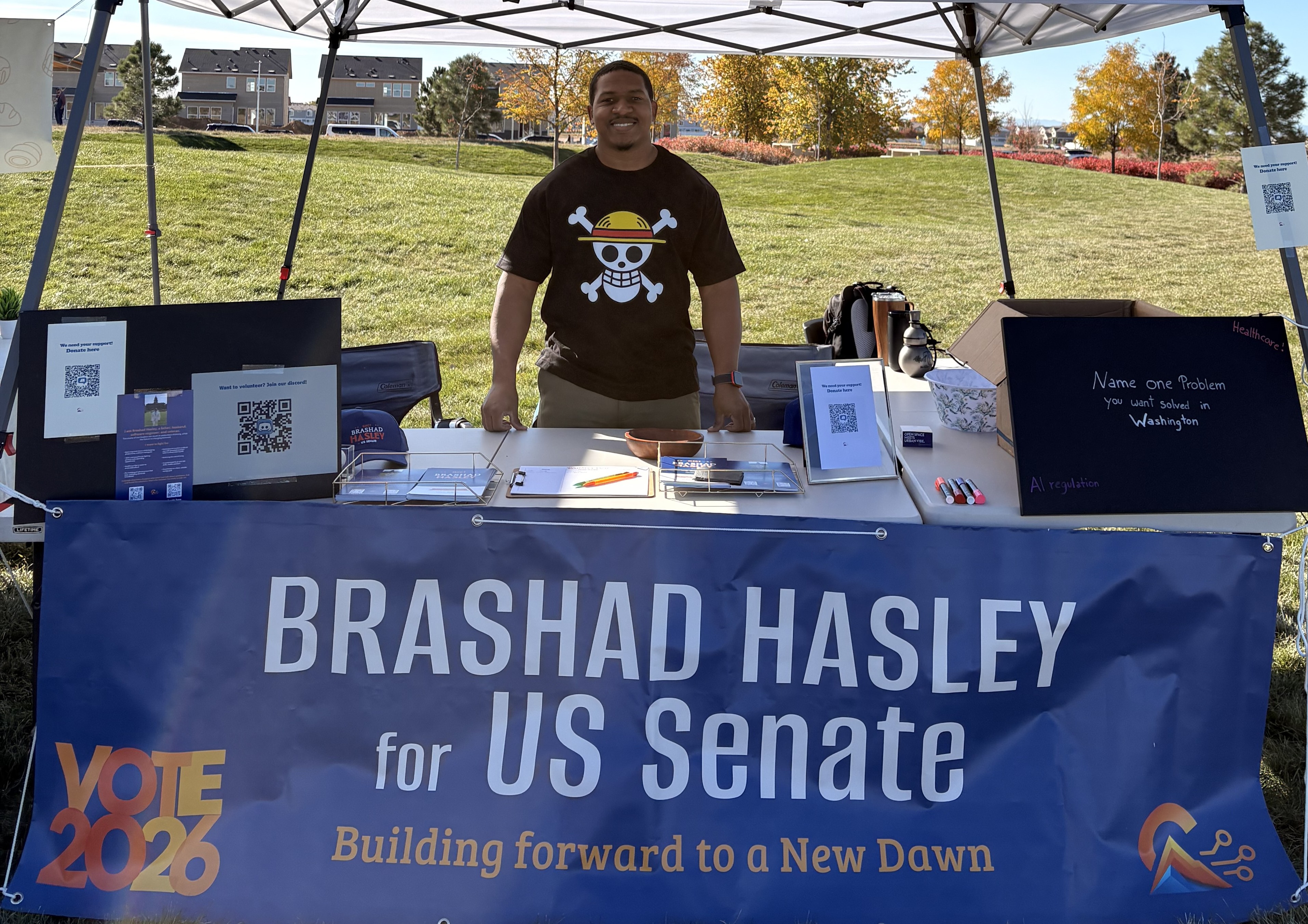 Brashad Hasley greeting Coloradans at a campaign booth